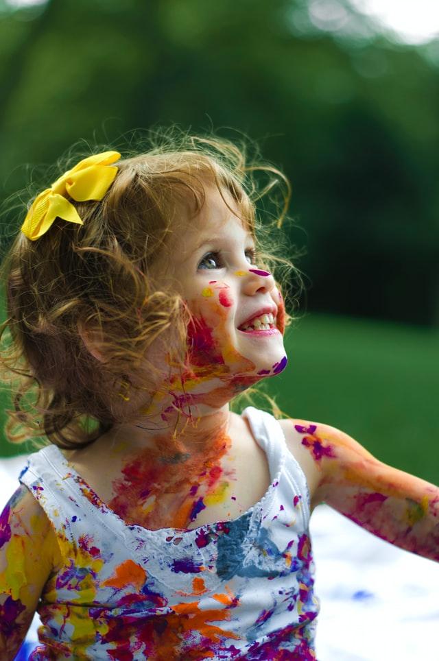 Child covered in paint